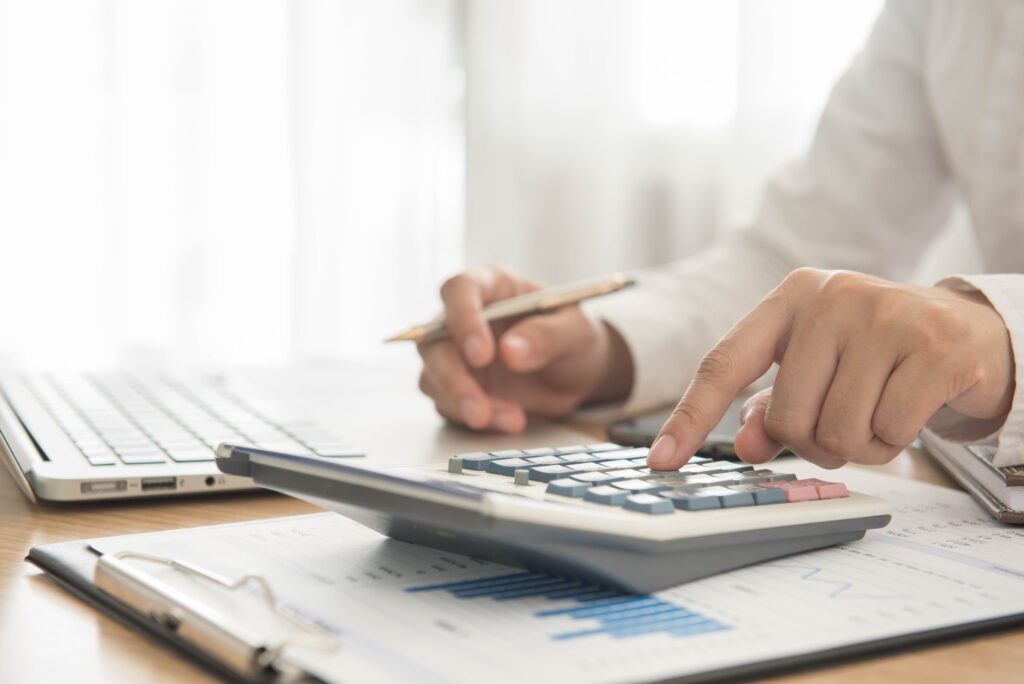 A Person Using Calculator